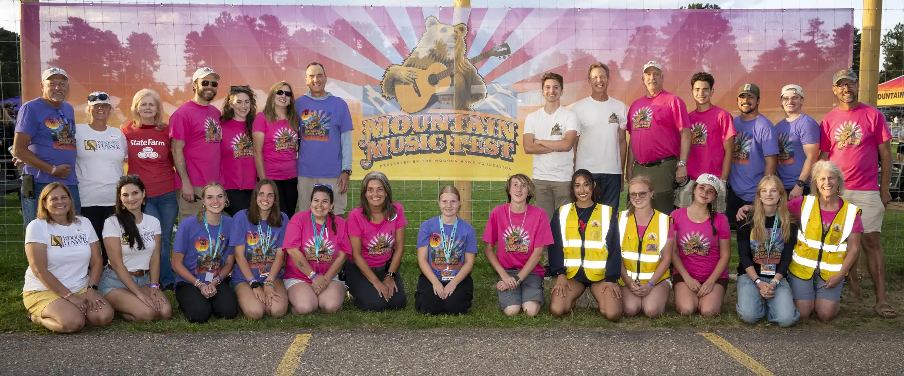 Volunteers from 2025 in front of MMF sign