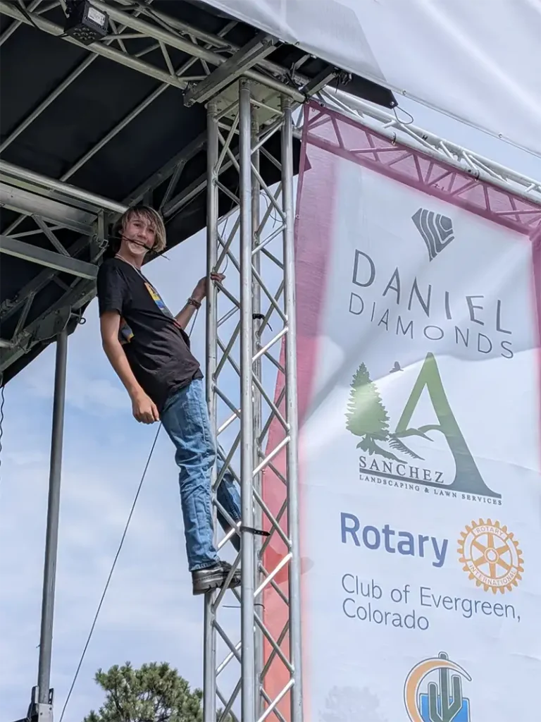 Waylon Keane stagehand on scaffolding
